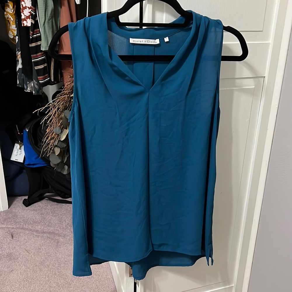 Peacock blue sleeveless blouse